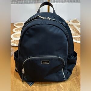 Kate Spade New York Dawn Large Backpack in black nylon with gold-tone hardware.